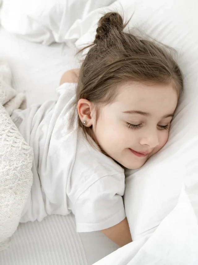 cute-little-girl-is-sleeping-white-bed_169016-6449
